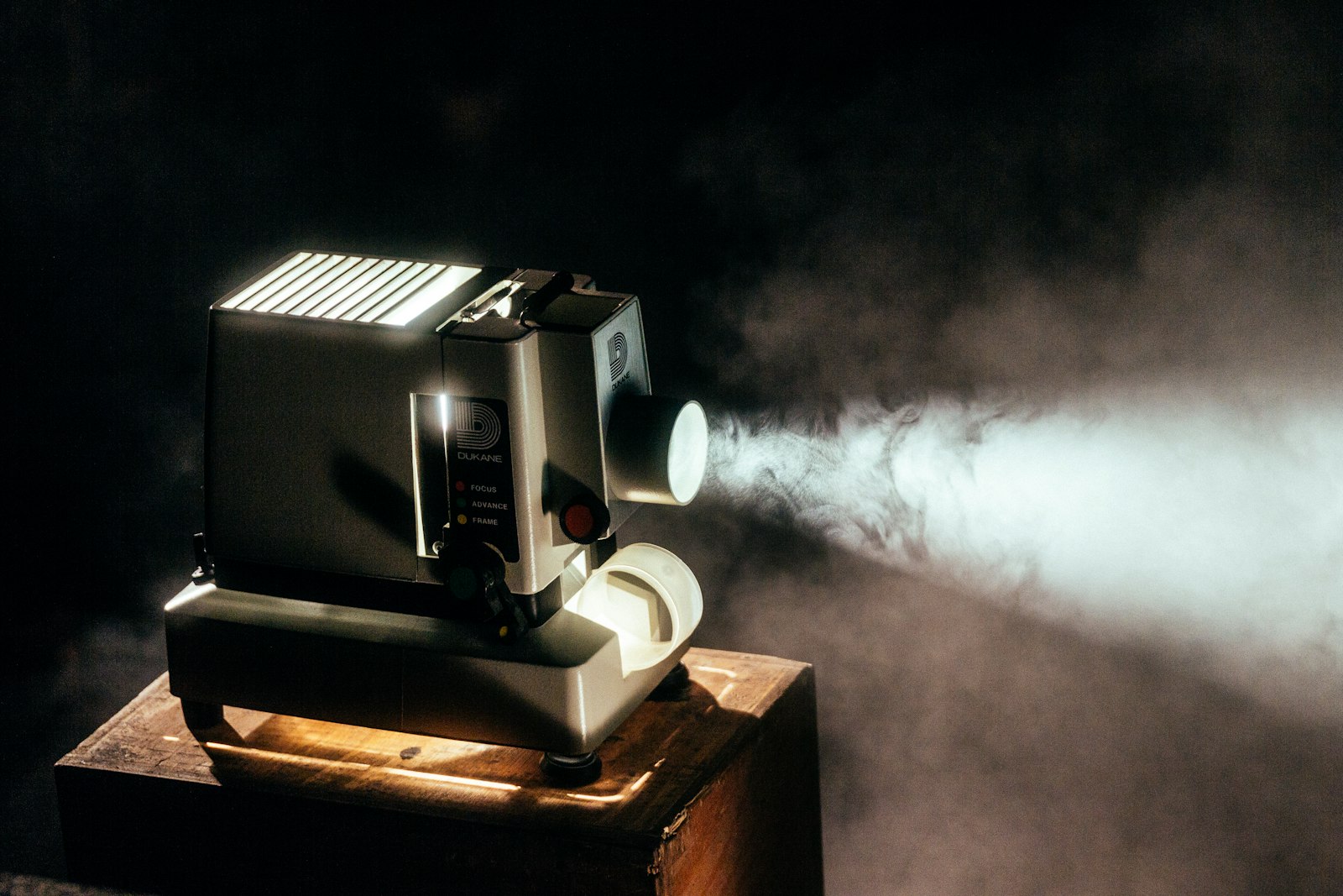 Film projector casting a beam of light